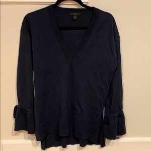 J Crew navy vneck sweater with tie cuff detail
